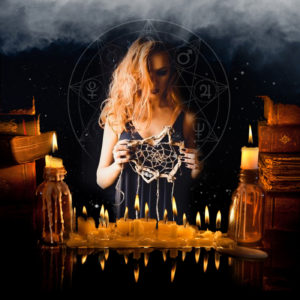 Image of Witch and Teacher, Fiona Duncan with candles and old books